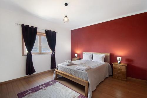 En eller flere senge i et værelse på Sousa's House - Alojamento Local