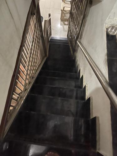 a flight of stairs in a building at light Inn pg home stay in Mathura