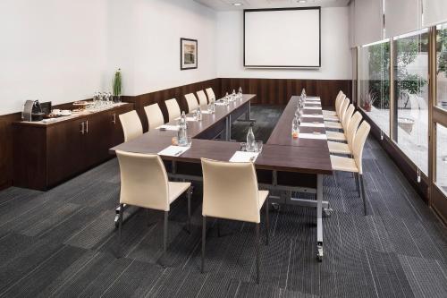 a large conference room with a long table and chairs at Melia Barajas in Madrid