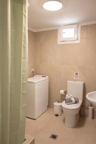 a bathroom with a toilet and a sink at Olia's House in Skala Eresou