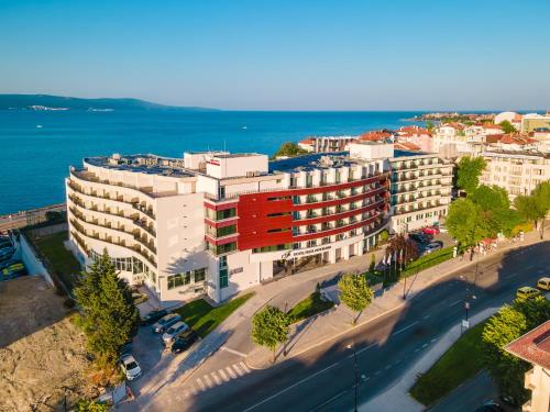 an overhead view of a large white building with a street at Festa Panorama Hotel in Nesebar