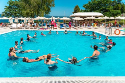 a group of people in the water in a swimming pool at Festa Panorama Hotel in Nesebar