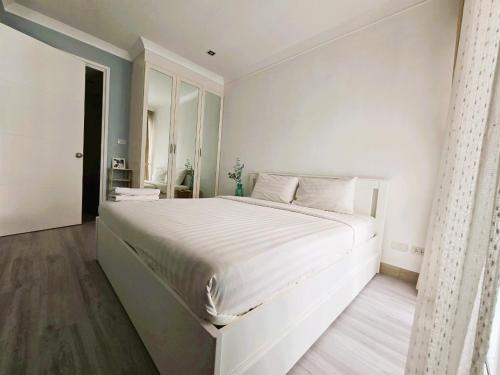 Ένα ή περισσότερα κρεβάτια σε δωμάτιο στο My Resort Condo with Pool View near Hua Hin Beach