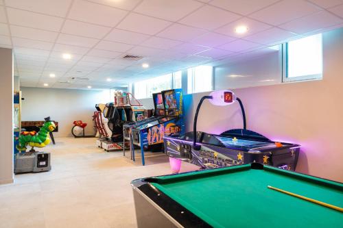 a billiard room with a pool table and many toys at Festa Panorama Hotel in Nesebar