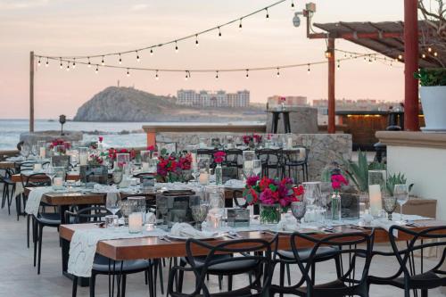 a table set up for a wedding on the beach at Hacienda del Mar Los Cabos, an Autograph Collection All-Inclusive Resort in Cabo San Lucas