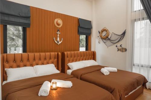 Ένα ή περισσότερα κρεβάτια σε δωμάτιο στο Fedora Moon Pool Villa Khanom