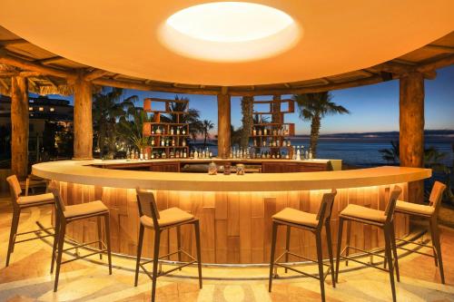 a bar with a view of the ocean at Hacienda del Mar Los Cabos, an Autograph Collection All-Inclusive Resort in Cabo San Lucas