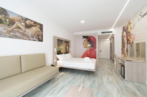 a living room with a couch and a painting on the wall at Max Motel - Art Gallery Room in Druento