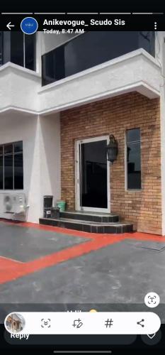 a picture of a building with a sign in front of it at Joak realty investment in Mama