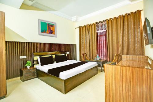 Ένα ή περισσότερα κρεβάτια σε δωμάτιο στο Hotel Kingston, Zirakpur
