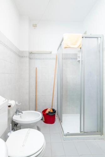 a bathroom with a shower and a toilet and a sink at Albergo Diffuso Balcone sul Friuli in Clauzetto