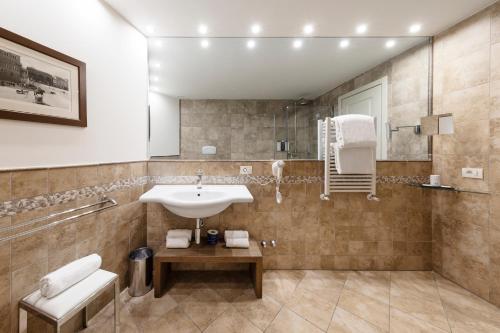 a bathroom with a sink and a shower at LHP Hotel Certaldo in Certaldo