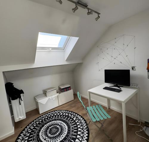 a room with a desk with a computer on it at Apartment Zum Wohlfühlen in Sulz am Neckar