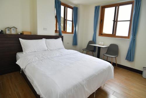 Una cama o camas en una habitación de 芹壁愛芹小築
