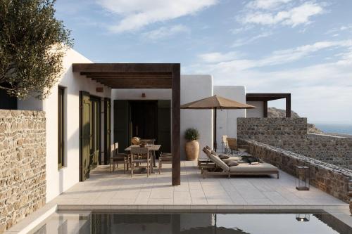 a villa with a view of the ocean at Armacaas Mykonos Hotel in Super Paradise Beach