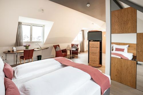 Voodi või voodid majutusasutuse Tailormade Hotel KRONE Sarnen toas