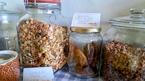 a group of jars filled with different types of food at Bed and Breakfast Via Rinaldi in Madonna del Sasso