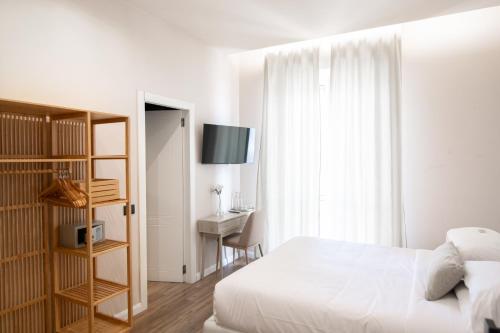 Letto o letti in una camera di Albium Hotel