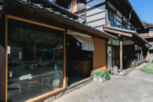 a store front of a building with a patio at MEKIKI古民家 in Yamanashi