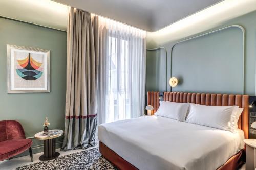 a hotel room with a bed and a window at Dimora Coppelle in Rome