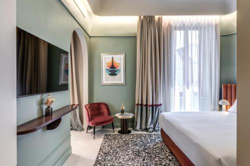 a hotel room with a bed and a window at Dimora Coppelle in Rome