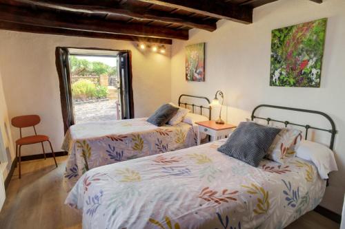 A bed or beds in a room at Celeste