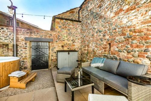 a living room with a brick wall and a couch at 2 Bed in Dalston oc-g32205 in Dalston