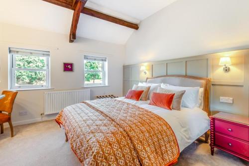 a bedroom with a large bed and two windows at 2 Bed in Dalston oc-g32205 in Dalston
