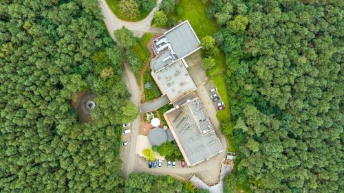 an overhead view of a building in the middle of a forest at Luksusowe Apartamenty Echo in Cedzyna