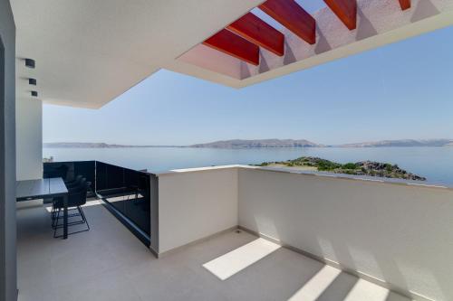 a room with a view of the water at Apartmani Olimp2 in Sveti Juraj