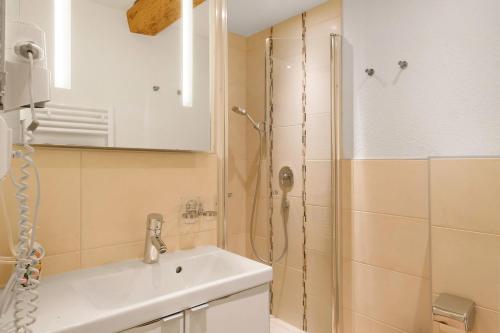 a bathroom with a sink and a shower at Müllerjörgenhof in Gutach