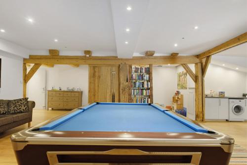 a living room with a pool table at Müllerjörgenhof in Gutach