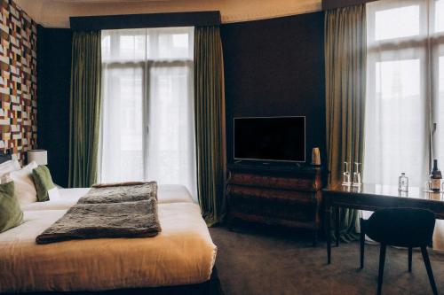 Cama o camas de una habitación en Hôtel Carlton Lille