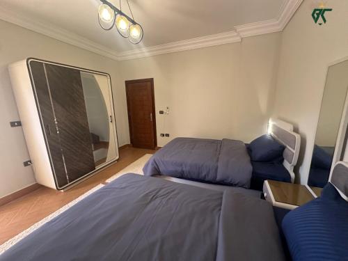 Postel nebo postele na pokoji v ubytování SKY LOUNGE by BC residence