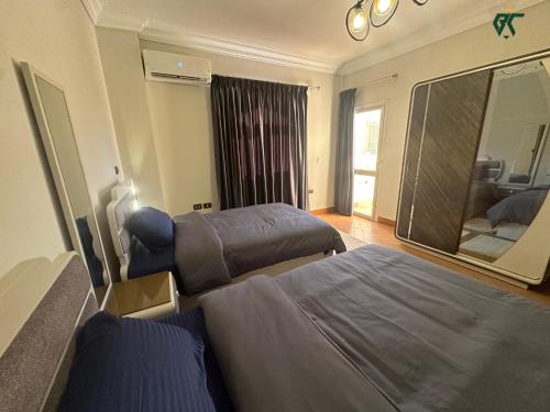 Postel nebo postele na pokoji v ubytování SKY LOUNGE by BC residence