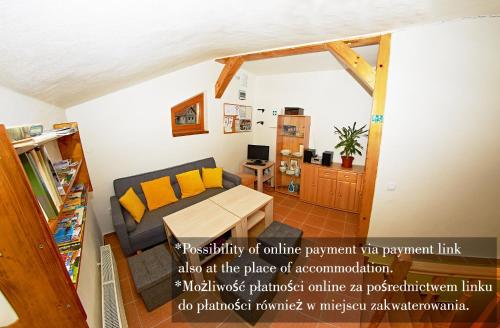 a living room with a couch and a table at Vila Rhea in Važec