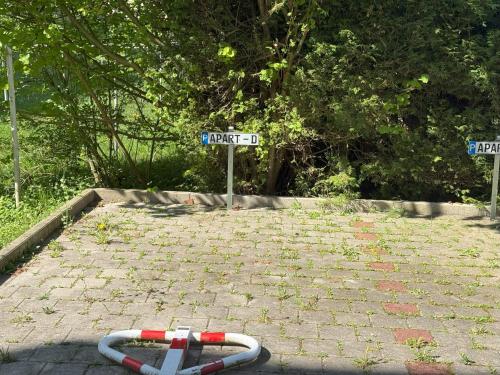 a street sign with a hose on a brick road at Apartment Passau D, Zentral, Cozy, Parking Place in Passau