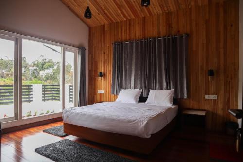 Postel nebo postele na pokoji v ubytování Willostays Snowmanor kodaikanal