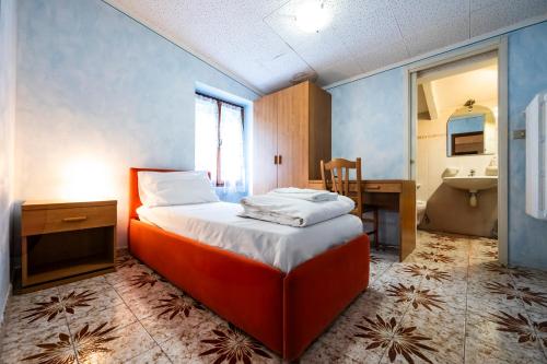 Postel nebo postele na pokoji v ubytování Albergo Monte Giove