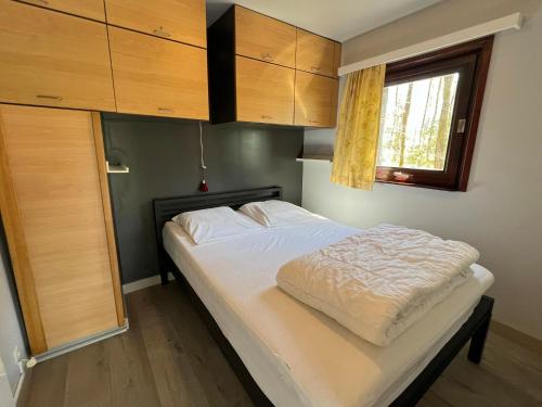 Postel nebo postele na pokoji v ubytování Lijsternest