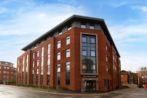 a red brick building with a black roof at For Students Only - Student Castle Reading in Reading