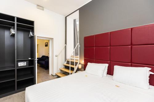 Un ou plusieurs lits dans un hébergement de l'établissement Hotel Castellino Roma