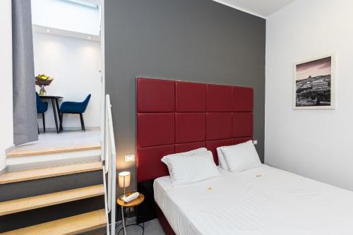 Un ou plusieurs lits dans un hébergement de l'établissement Hotel Castellino Roma