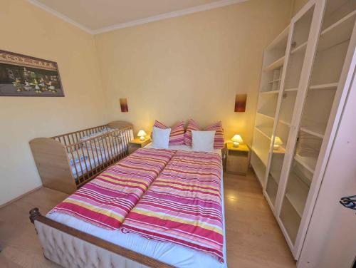 a bedroom with a large bed with pillows and shelves at Holiday home in Siofok - Balaton 19638 in Siófok