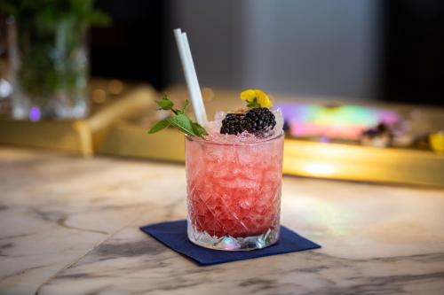 a drink on a blue napkin on a table at Harbour Hotel & Spa Brighton in Brighton & Hove