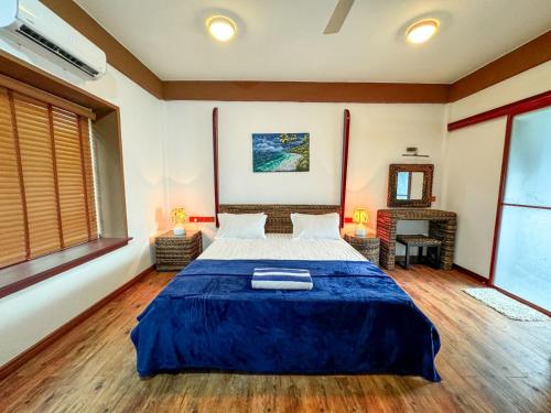 Postel nebo postele na pokoji v ubytování Long Beach Laamu Hotel