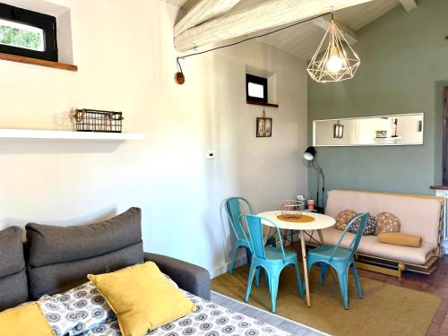 a living room with a couch and a table at fattoria Coppetella Cemani in Molino dʼAgugliano