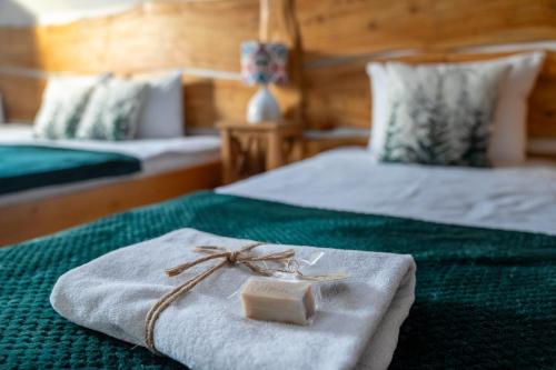 a box of soap sitting on top of two beds at Tarninowe Wzgórze in Kunkowa