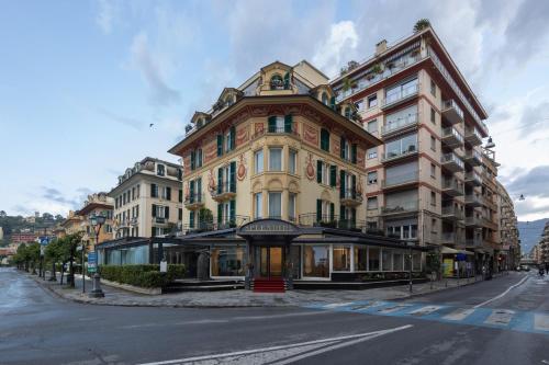 a building on the corner of a street at Splendide Riviera Boutique Art Hotel in Rapallo