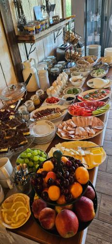 a buffet line with many different types of food at Tarninowe Wzgórze in Kunkowa